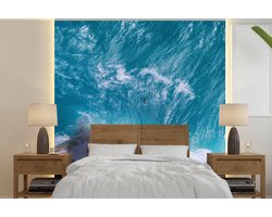 Behang - Fotobehang Blauwe golven bij Kelingking Beach in Indonesië - Breedte 220 cm x hoogte 220 cm