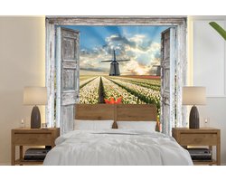 Behang - Fotobehang Bloemen - Molen - Lente - Doorkijk - Breedte 260 cm x hoogte 260 cm