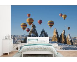 Behang - Fotobehang Luchtballon - Stenen - Sneeuw - Breedte 390 cm x hoogte 260 cm