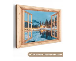Canvas schilderij 120x80 cm - Wanddecoratie Winterlandschap - Natuur - Huis - Bergen - Doorkijk - Raam - Muurdecoratie woonkamer - Slaapkamer decoratie - Kamer accessoires - Schilderijen op canvas
