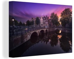 Canvas schilderij 150x100 cm - Wanddecoratie Afbeelding van de Keizersgracht in Amsterdam onder een kleurrijke lucht - Muurdecoratie woonkamer - Slaapkamer decoratie - Kamer accessoires - Schilderijen