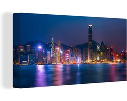 Canvas schilderij 160x80 cm - Wanddecoratie De skyline van Hong Kong en de Victoria Harbour tijdens de nacht - Muurdecoratie woonkamer - Slaapkamer decoratie - Kamer accessoires - Schilderijen
