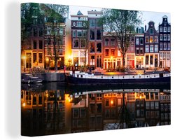 Canvas schilderij 180x120 cm - Wanddecoratie Grachtenpanden in Amsterdam tijdens de avond - Muurdecoratie woonkamer - Slaapkamer decoratie - Kamer accessoires - Schilderijen