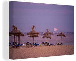 Canvas schilderij 180x120 cm - Wanddecoratie Ligbedden op strand Mallorca - Muurdecoratie woonkamer - Slaapkamer decoratie - Kamer accessoires - Schilderijen