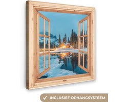 Canvas schilderij 20x20 cm - Wanddecoratie Winterlandschap - Natuur - Huis - Bergen - Doorkijk - Raam - Muurdecoratie woonkamer - Slaapkamer decoratie - Kamer accessoires - Schilderijen op canvas