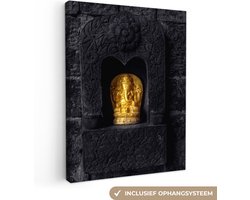 Canvas schilderij 60x80 cm - Wanddecoratie Ganesha beeld - Goud - Spiritueel - Bakstenen - Zwart - Muurdecoratie woonkamer - Slaapkamer decoratie - Kamer accessoires - Schilderijen op canvas