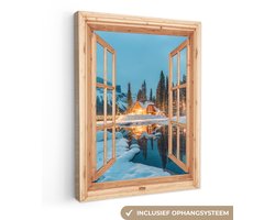 Canvas schilderij 60x80 cm - Wanddecoratie Winterlandschap - Natuur - Huis - Bergen - Doorkijk - Raam - Muurdecoratie woonkamer - Slaapkamer decoratie - Kamer accessoires - Schilderijen op canvas