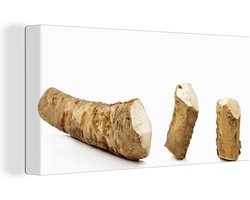 Canvas Schilderij Gesneden mierikswortel met de smaken in het midden - 40x20 cm - Wanddecoratie