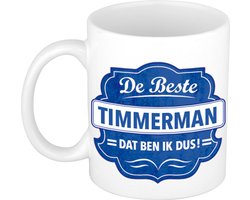 De beste timmerman cadeau koffiemok / theebeker wit met blauw embleem - 300 ml - keramiek - cadeaumok timmerman / meubelmaker / schrijnwerker