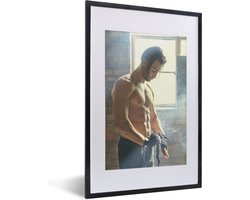 Fotolijst incl. Poster - Een gespierde man wikkelt stof om zijn handen - 40x60 cm - Posterlijst