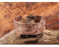 Koperen armband met drakenpatroon