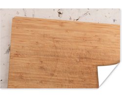 Poster Een houten snijplank op een decoratieve ondergrond - 60x40 cm
