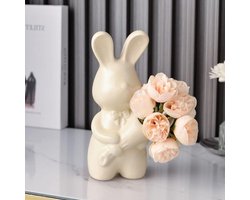 Sculptuur van een keramische konijn met bloemen, decoratieve beeldjes voor woonkamer, kantoor en plank, ideaal als vaas en interieuraccessoire in crèmekleur.