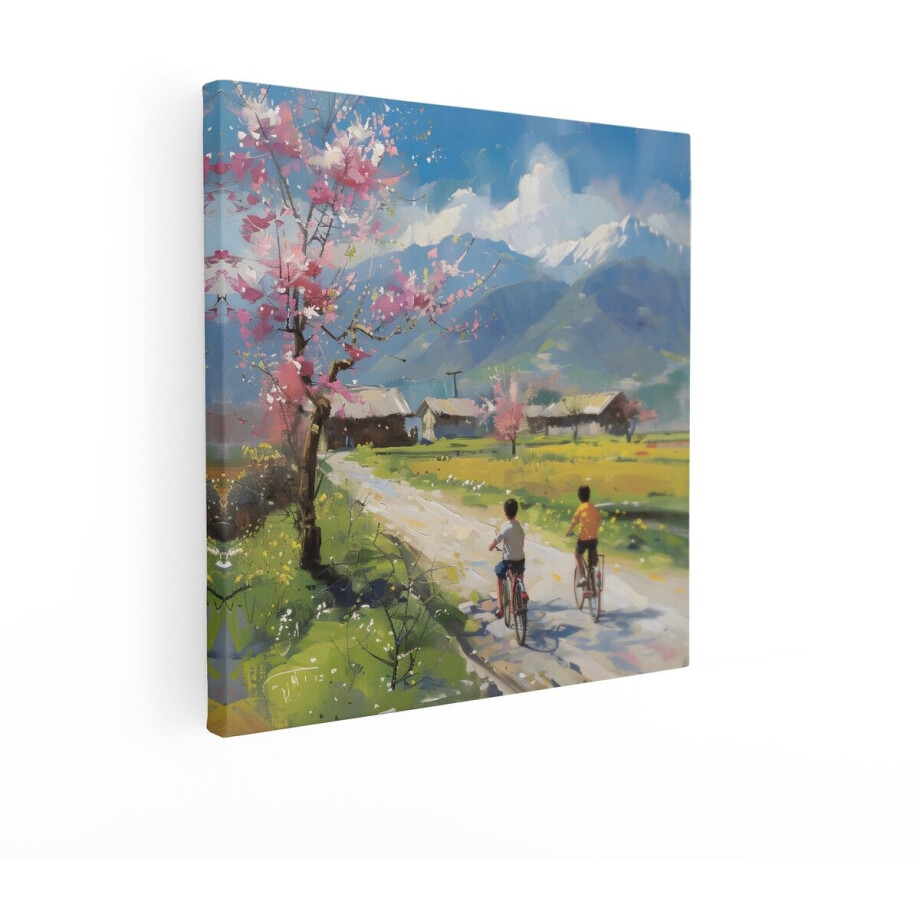 Artaza Canvas Schilderij Twee Jongens Fietsen door een Dorp met Bloeiende Kersenbomen en Bergen - 70x70 cm - Wanddecoratie Woonkamer - Schilderijen - Muurdecoratie afbeelding 1