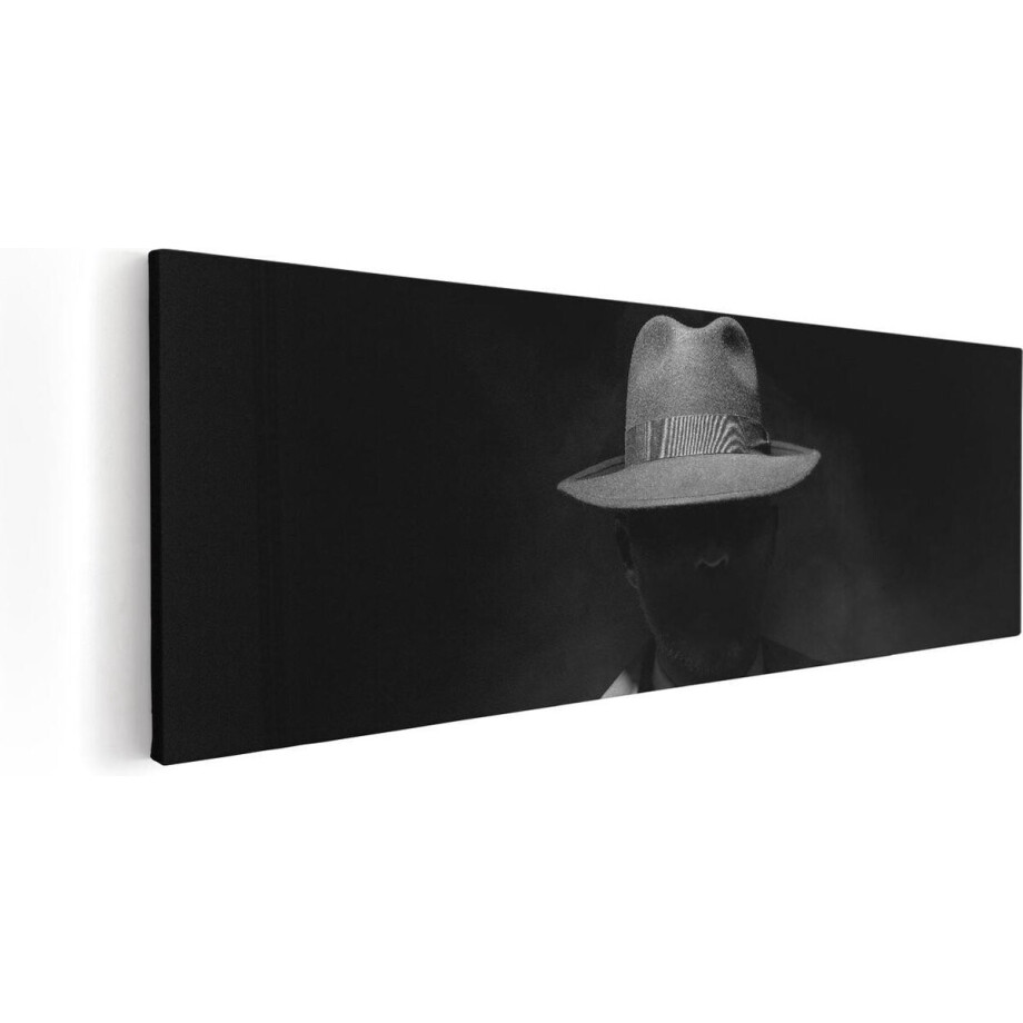 Artaza Canvas Schilderij Man Met Een Hoedje In Het Donker - Zwart Wit - 90x30 - Foto Op Canvas - Canvas Print afbeelding 1