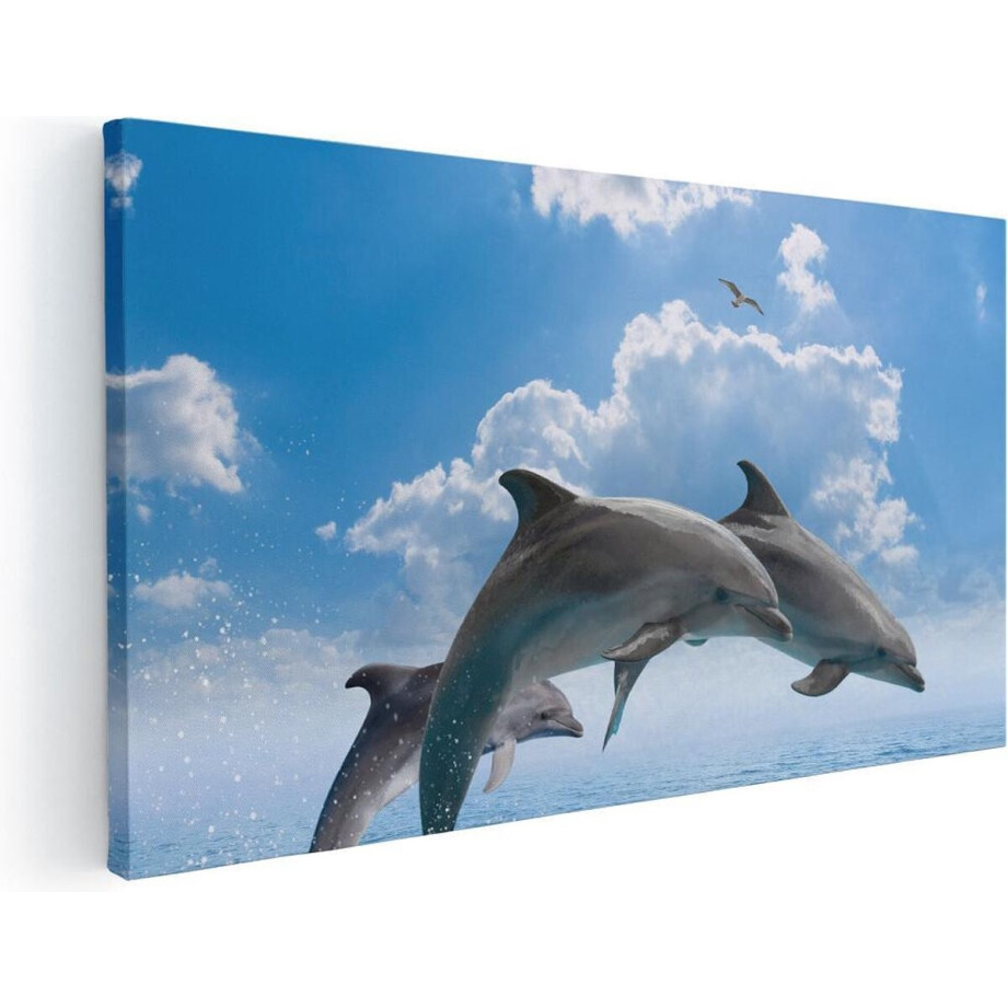 Artaza Canvas Schilderij Dolfijnen Springen uit de Blauwe Zee - 80x40 - Foto Op Canvas - Canvas Print afbeelding 1