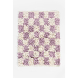 Lila geblokte badmat