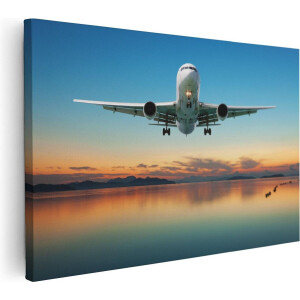 Artaza Canvas Schilderij Vliegtuig Vliegt Boven Een Kleurrijke Zee - 60x40 cm - Wanddecoratie Woonkamer - Schilderijen - Muurdecoratie