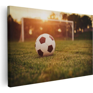 Artaza Canvas Schilderij Voetbal Met Goal Tijdens Zonsondergang - 120x80 cm - Groot - Wanddecoratie Woonkamer - Schilderijen - Muurdecoratie